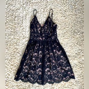 Black and pinkish colored dress. Cozy fit and practically brand new!